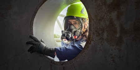 Worker in a Confined Space with PPE
