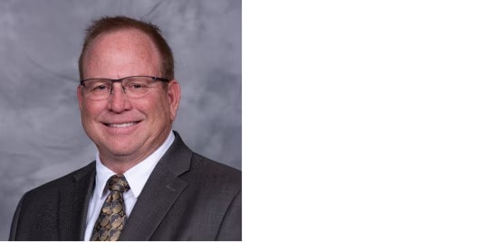 Professional color headshot.
