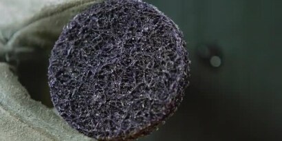 Scotch-Brite™ Clean and Strip XT Disc removing rust from metal
