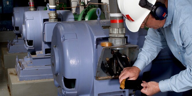worker repairing motor
