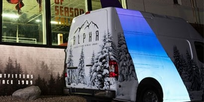 blue reflective graphic film on the exterior of a van
