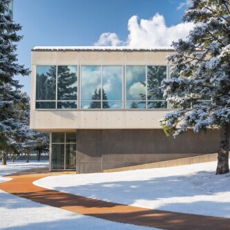 exterior image of windowed building with snow
