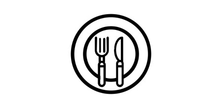 A restaurant full of set tables has attractive finishes on its countertops and floors.
