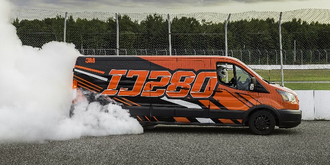 commercial van wrapped in 3M IJ280 wrap film burning rubber on a track
